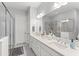 Bright and spacious bathroom with double vanity, ample counter space, and glass-enclosed shower at 2301 Datura Loop, St Cloud, FL 34772