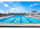 A community lap pool, ideal for exercise and relaxation with plenty of seating at 2301 Datura Loop, St Cloud, FL 34772