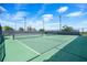 Well-maintained tennis court with green surface and white lines for a competitive match at 2301 Datura Loop, St Cloud, FL 34772