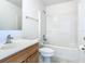 Bright bathroom with a single sink vanity and a shower and bathtub combination at 2384 Andrews Valley Dr, Kissimmee, FL 34758