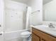 Bathroom featuring a tub with shower, vanity with storage, and neutral finishes at 2384 Andrews Valley Dr, Kissimmee, FL 34758
