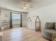 Cozy bedroom with wood floors, crib, view out a large window, and room for a comfy chair at 2384 Andrews Valley Dr, Kissimmee, FL 34758
