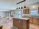 Kitchen area with light wood cabinets, granite countertops, and stainless steel appliances at 2384 Andrews Valley Dr, Kissimmee, FL 34758