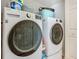 Modern laundry room with white LG washer and dryer for convenience in a well-lit space at 2384 Andrews Valley Dr, Kissimmee, FL 34758