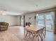 Spacious living area with patio access offers seamless indoor-outdoor flow and relaxed seating for enjoyment at 2384 Andrews Valley Dr, Kissimmee, FL 34758
