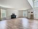 Bright living room with hardwood floors, neutral walls, and natural light from large windows at 2384 Andrews Valley Dr, Kissimmee, FL 34758