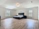 Spacious main bedroom with wood flooring, large windows for natural light, and neutral wall colors at 2384 Andrews Valley Dr, Kissimmee, FL 34758
