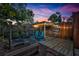 Cozy backyard space with wooden deck, shelter, string lights and two chairs, perfect for relaxing and entertaining at 2450 Mcintosh Way, Maitland, FL 32751