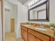 Spacious bathroom features a double vanity, granite counters, tile floor and ample lighting at 2450 Mcintosh Way, Maitland, FL 32751