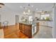 Spacious kitchen island with granite countertops, white cabinetry, and open layout at 2450 Mcintosh Way, Maitland, FL 32751