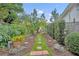 Landscaped walking path with brick pavers and well-manicured shrubs at 2450 Mcintosh Way, Maitland, FL 32751