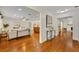 Open-concept living space with hardwood floors, neutral decor, and seamless flow at 2450 Mcintosh Way, Maitland, FL 32751