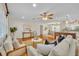 Bright living room featuring hardwood floors, neutral decor, and abundant natural light at 2450 Mcintosh Way, Maitland, FL 32751