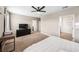 Generous bedroom features plush carpet, natural light, a ceiling fan, and closet access at 266 Caryota Ct, New Smyrna Beach, FL 32168
