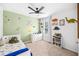 Dinosaur themed bedroom with dinosaur accents, carpeted floors, and natural light at 266 Caryota Ct, New Smyrna Beach, FL 32168