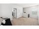 Cozy bedroom with neutral walls, and plush carpet, offers a serene and inviting atmosphere at 266 Caryota Ct, New Smyrna Beach, FL 32168