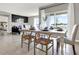 Bright dining area with table set for a meal, a stylish mix of chairs, and sliding doors to the outside at 2665 Trinidad Rd, Haines City, FL 33844