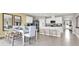 Open-concept kitchen and dining area, seamlessly blending a modern kitchen with a stylishly set dining table at 2665 Trinidad Rd, Haines City, FL 33844