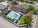 Aerial view showcases a pool, yard, dining area, and beautiful home at 2801 Plaza Terrace Dr, Orlando, FL 32803