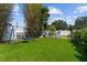 Spacious backyard featuring lush green lawn, swing set, and play area, great for Gathering activities at 2801 Plaza Terrace Dr, Orlando, FL 32803