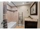 Tiled bathroom featuring a shower-tub combo, granite vanity, and decorative ladder at 2801 Plaza Terrace Dr, Orlando, FL 32803