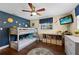 Cozy bedroom with a bunk bed, ceiling fan, and hardwood floors at 2801 Plaza Terrace Dr, Orlando, FL 32803