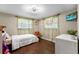 Bright bedroom featuring hardwood floors, a rocking chair, and natural light at 2801 Plaza Terrace Dr, Orlando, FL 32803