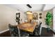 Bright dining area with a wood table, stylish chairs, and a view of the kitchen at 2801 Plaza Terrace Dr, Orlando, FL 32803