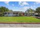 Charming one-story home featuring a well-manicured lawn and a classic brick border at 2801 Plaza Terrace Dr, Orlando, FL 32803