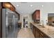 Well-lit kitchen with granite countertops, stainless steel appliances, and tile floors at 2801 Plaza Terrace Dr, Orlando, FL 32803
