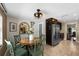 Cozy dining area with modern lighting fixture, stainless steel refrigerator, and view to the kitchen at 2801 Plaza Terrace Dr, Orlando, FL 32803