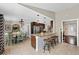 Open kitchen with granite counters, stainless steel appliances, pendant lighting, and eat-in dining area at 2801 Plaza Terrace Dr, Orlando, FL 32803