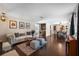 Inviting living room with hardwood floors, cozy seating, and an adjacent dining area at 2801 Plaza Terrace Dr, Orlando, FL 32803