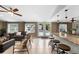 Open floor plan with a modern bar, lounge seating, and a view of the backyard pool at 2801 Plaza Terrace Dr, Orlando, FL 32803