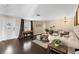 Bright living room featuring hardwood floors, comfortable seating, and a grand piano at 2801 Plaza Terrace Dr, Orlando, FL 32803