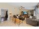 Bright living room with tile floors, ceiling fan, comfortable seating, and a view to the front entrance at 2801 Plaza Terrace Dr, Orlando, FL 32803