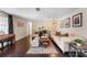 Spacious living room with hardwood floors, decorative rugs, and a comfortable seating arrangement at 2801 Plaza Terrace Dr, Orlando, FL 32803