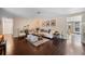 Open living room with hardwood floors, neutral paint, modern decor, and natural light at 2801 Plaza Terrace Dr, Orlando, FL 32803