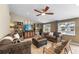 Cozy living room with comfortable couches, a chessboard ottoman, and a view of the pool at 2801 Plaza Terrace Dr, Orlando, FL 32803