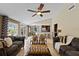 Open-concept living room with tile floors, ceiling fan, a view of the kitchen and backyard pool at 2801 Plaza Terrace Dr, Orlando, FL 32803