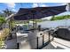 Outdoor kitchen is fully equipped with stainless steel grill and sink for effortless entertaining at 2801 Plaza Terrace Dr, Orlando, FL 32803