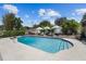 Sparkling in-ground swimming pool with surrounding deck, lounge chairs, and umbrellas at 2801 Plaza Terrace Dr, Orlando, FL 32803