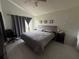 Bedroom with vaulted ceiling and tiled floor at 307 Hollingshead Loop, Davenport, FL 33896