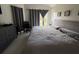 Well-lit bedroom with vaulted ceiling and tiled floor at 307 Hollingshead Loop, Davenport, FL 33896