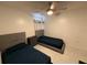 Well-lit bedroom with two beds, a ceiling fan, and a tile floor at 307 Hollingshead Loop, Davenport, FL 33896