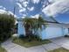 Charming single-Gathering home with an attached garage and landscaping at 307 Hollingshead Loop, Davenport, FL 33896