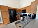 Kitchen featuring wooden cabinets, stainless steel appliances, and laminate countertops at 307 Hollingshead Loop, Davenport, FL 33896