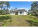 Expansive backyard featuring lush green grass, ideal for outdoor activities and relaxation at 3072 Sw 168Th Loop, Ocala, FL 34473