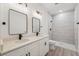 Bathroom features a double vanity, quartz countertop, and a tiled walk-in shower at 3072 Sw 168Th Loop, Ocala, FL 34473