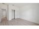 Bright bedroom with light-toned wood-look floors, a closet, and a fresh, modern feel at 3072 Sw 168Th Loop, Ocala, FL 34473